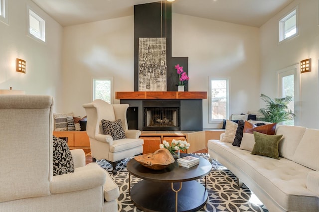 living room with a wealth of natural light and a high ceiling