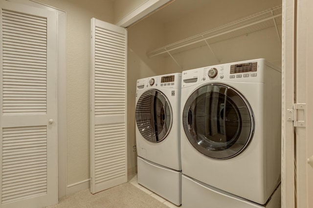 laundry area with separate washer and dryer