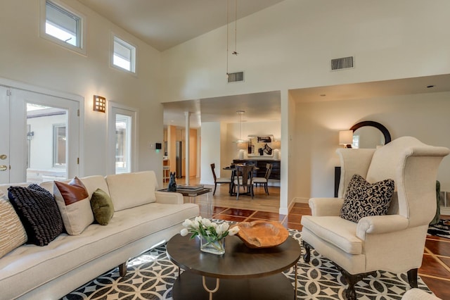 living room with a high ceiling