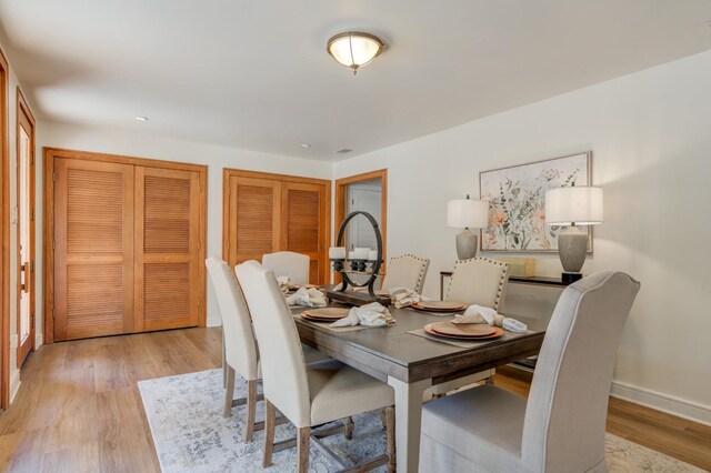 dining space featuring light hardwood / wood-style floors