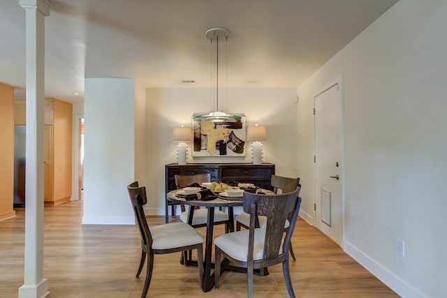 dining space with light wood-type flooring