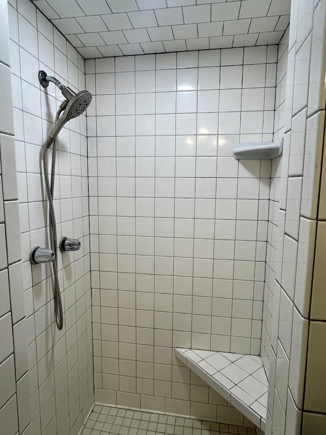 bathroom with a tile shower