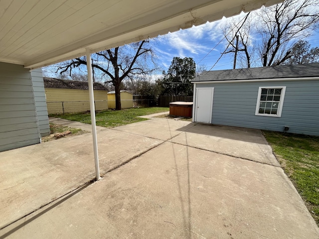 view of patio featuring a fenced backyard and an outdoor structure