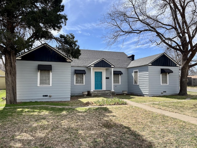 view of front of house featuring board and batten siding, crawl space, roof with shingles, and a front lawn