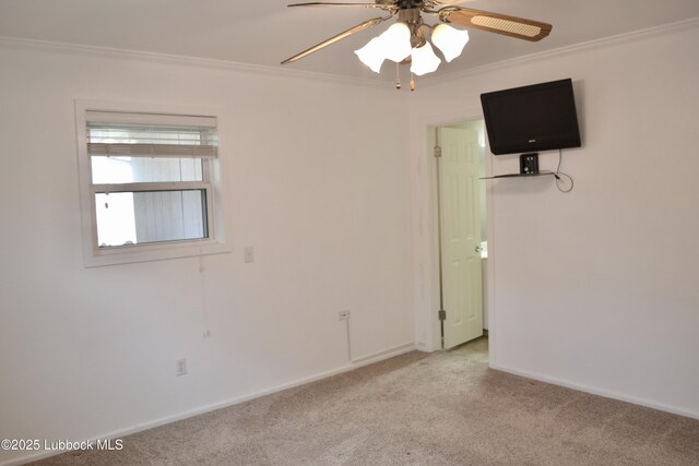 200 Crescent Dr, Littlefield, TX 79339 - spare room featuring crown molding, light carpet, baseboards, and ceiling fan