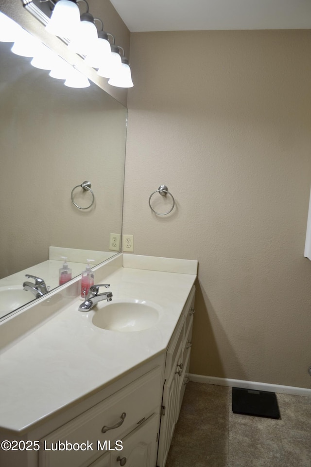 200 Crescent Dr, Littlefield, TX 79339 - bathroom featuring vanity and baseboards