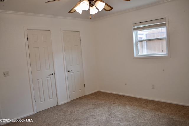 200 Crescent Dr, Littlefield, TX 79339 - unfurnished bedroom with ornamental molding, carpet floors, a ceiling fan, and baseboards