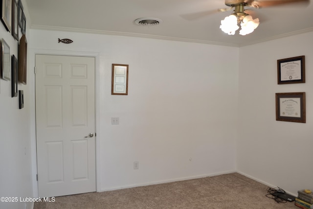 200 Crescent Dr, Littlefield, TX 79339 - carpeted empty room featuring ornamental molding, baseboards, a ceiling fan, and visible vents