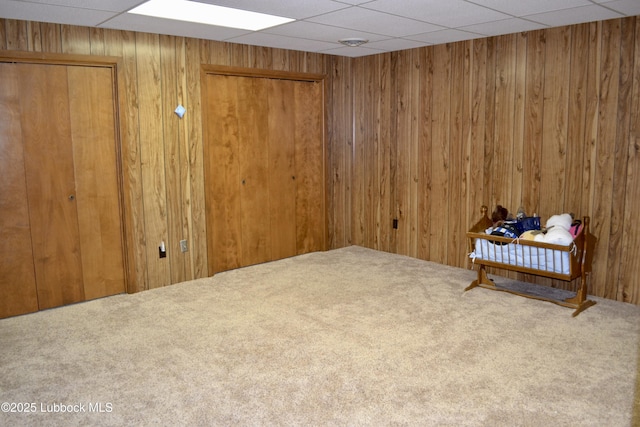 200 Crescent Dr, Littlefield, TX 79339 - empty room featuring carpet flooring and wood walls
