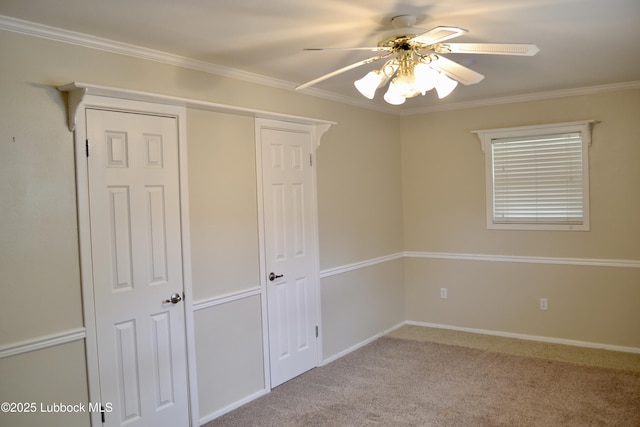 200 Crescent Dr, Littlefield, TX 79339 - unfurnished bedroom with ceiling fan, baseboards, ornamental molding, and carpet floors