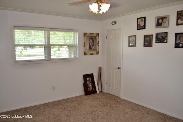 200 Crescent Dr, Littlefield, TX 79339 - carpeted spare room featuring baseboards, ornamental molding, and ceiling fan