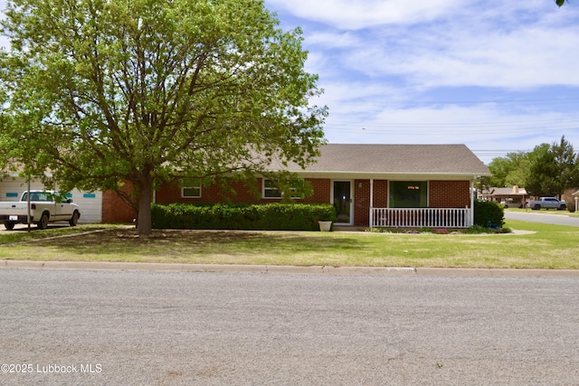 200 Crescent Dr, Littlefield, TX 79339 - ranch-style home with covered porch, brick siding, and a front yard