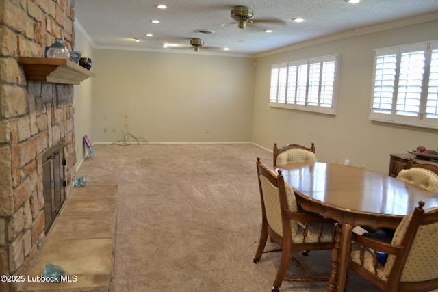 200 Crescent Dr, Littlefield, TX 79339 - dining area featuring ornamental molding, a stone fireplace, ceiling fan, and recessed lighting