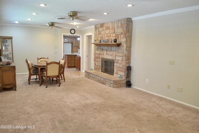 200 Crescent Dr, Littlefield, TX 79339 - dining area featuring a ceiling fan, a stone fireplace, light carpet, ornamental molding, and recessed lighting