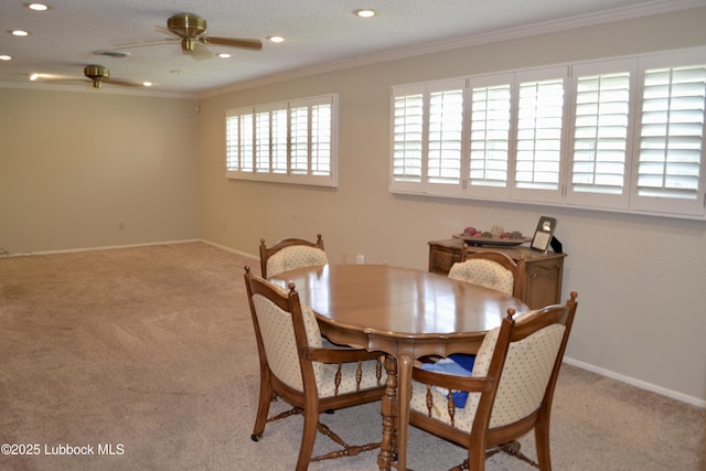 200 Crescent Dr, Littlefield, TX 79339 - dining space featuring light colored carpet, ornamental molding, recessed lighting, ceiling fan, and baseboards