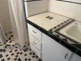 bathroom featuring tile patterned flooring and curtained shower