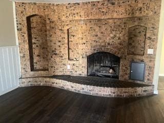 interior details featuring hardwood / wood-style flooring and a fireplace