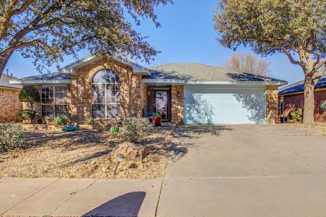 ranch-style house featuring a garage