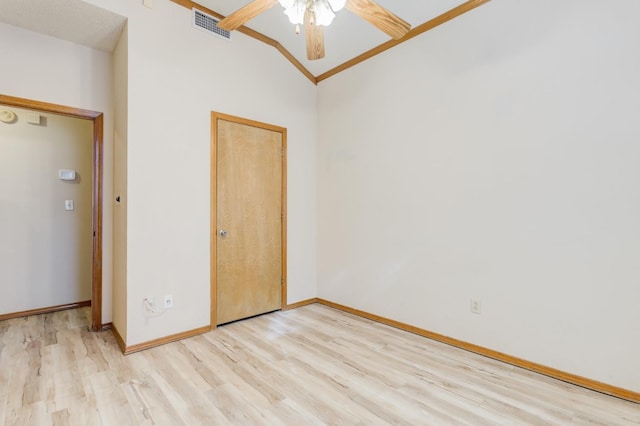 unfurnished room featuring vaulted ceiling, ceiling fan, and light hardwood / wood-style flooring