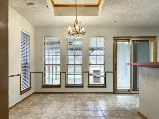 unfurnished dining area featuring light tile patterned floors, a textured ceiling, and a chandelier