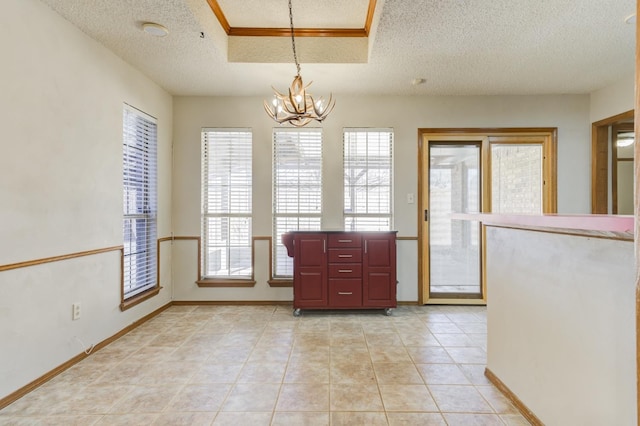 unfurnished dining area featuring an inviting chandelier, a textured ceiling, and light tile patterned floors