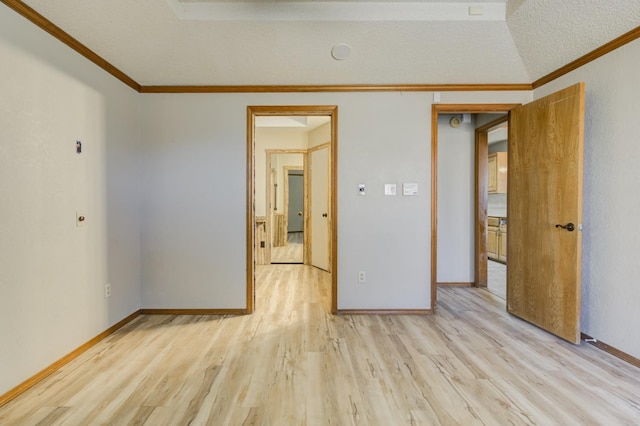 unfurnished bedroom with crown molding, a textured ceiling, and light hardwood / wood-style floors