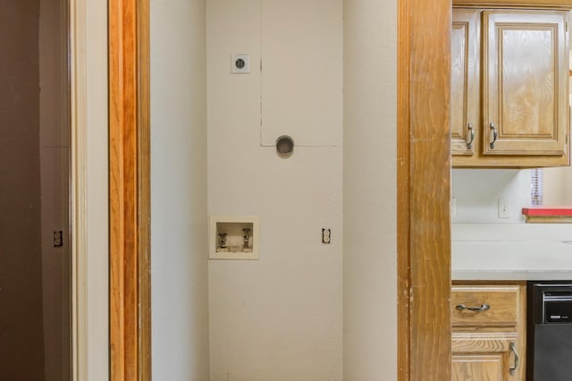 washroom with cabinets, hookup for an electric dryer, and washer hookup