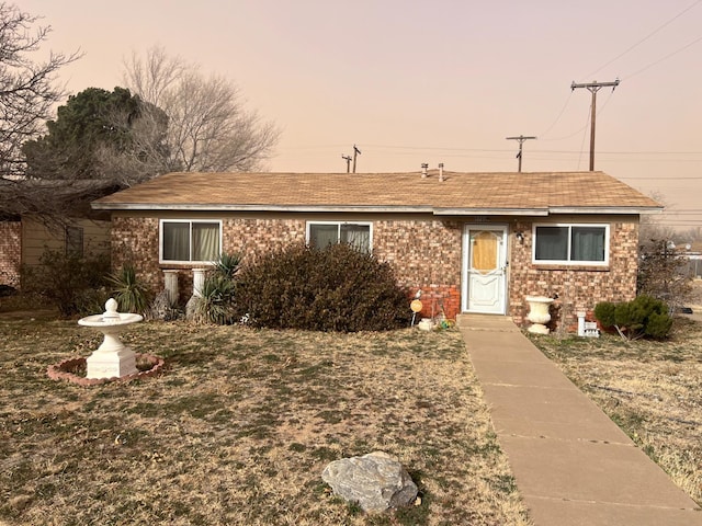 ranch-style house with a yard