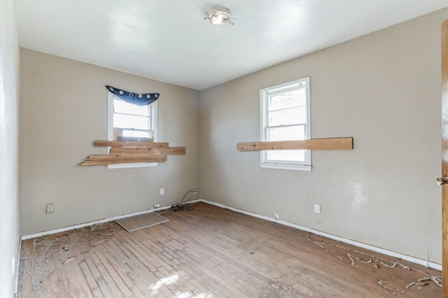 unfurnished room with light hardwood / wood-style flooring