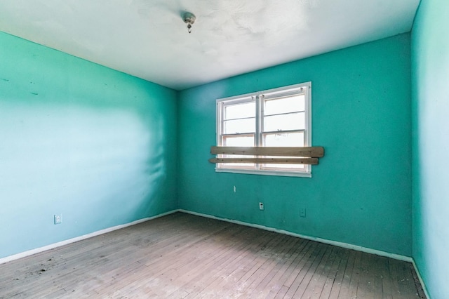 unfurnished room featuring light hardwood / wood-style floors