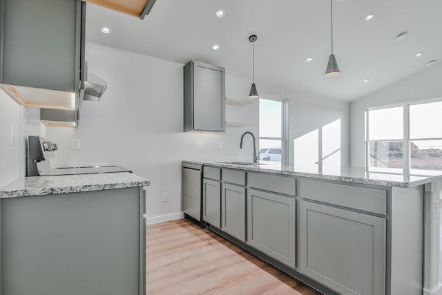 kitchen featuring range, dishwasher, a sink, gray cabinetry, and a peninsula