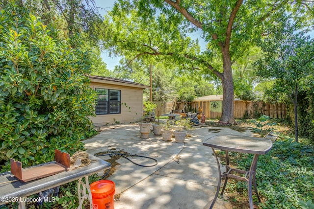 3413 42nd St, Lubbock, TX 79413 - fenced backyard with a patio area