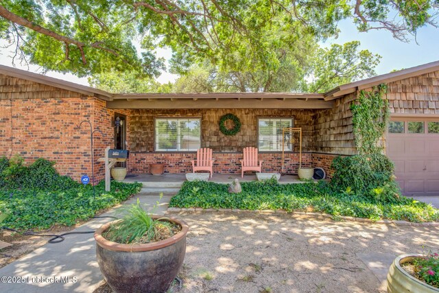 3413 42nd St, Lubbock, TX 79413 - porch featuring a garage