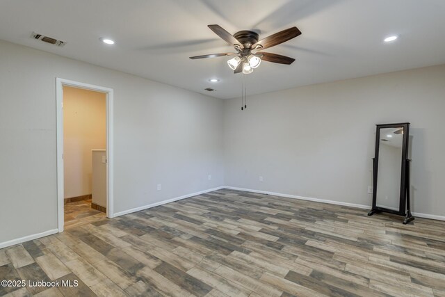 3413 42nd St, Lubbock, TX 79413 - unfurnished room featuring a ceiling fan, wood finished floors, recessed lighting, and baseboards