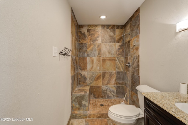 3413 42nd St, Lubbock, TX 79413 - bathroom with tiled shower, vanity, toilet, and recessed lighting