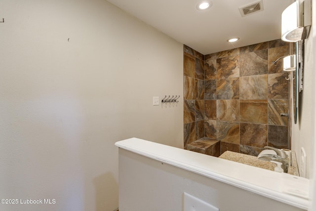 3413 42nd St, Lubbock, TX 79413 - bathroom with tiled shower and recessed lighting