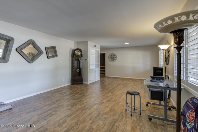3413 42nd St, Lubbock, TX 79413 - living room featuring wood finished floors, baseboards, and recessed lighting