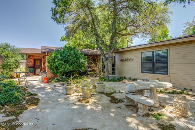 3413 42nd St, Lubbock, TX 79413 - view of front of property with a patio area and brick siding