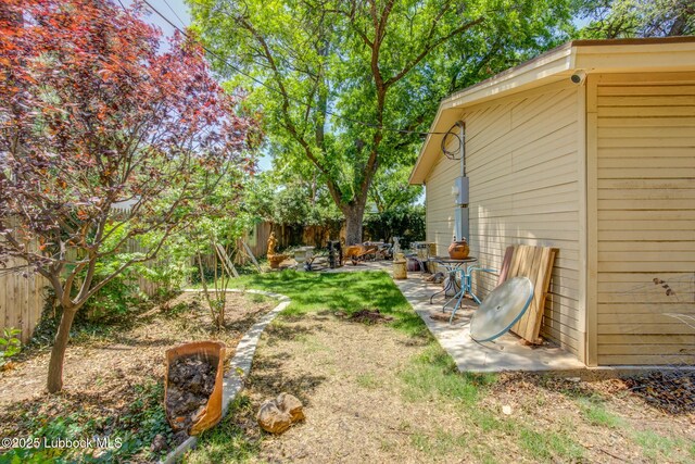 3413 42nd St, Lubbock, TX 79413 - fenced backyard with a patio