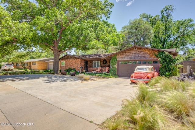 3413 42nd St, Lubbock, TX 79413 - view of front of house with driveway and an attached garage