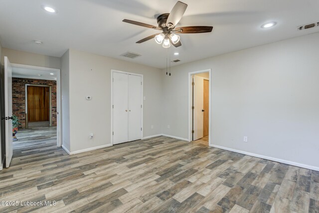 3413 42nd St, Lubbock, TX 79413 - unfurnished bedroom featuring baseboards, wood finished floors, recessed lighting, and ceiling fan