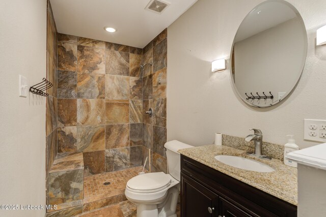 3413 42nd St, Lubbock, TX 79413 - full bath featuring vanity, tiled shower, and toilet