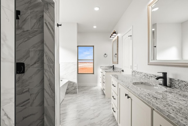 bathroom featuring vanity and separate shower and tub