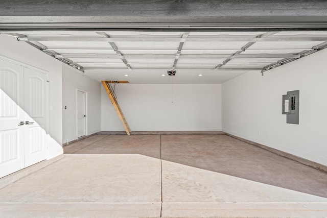 garage featuring a garage door opener and electric panel