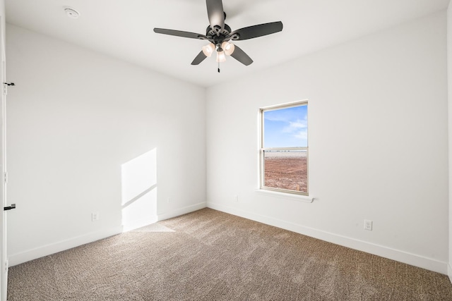 empty room featuring carpet and ceiling fan