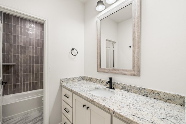 full bathroom with vanity, toilet, and tiled shower / bath combo