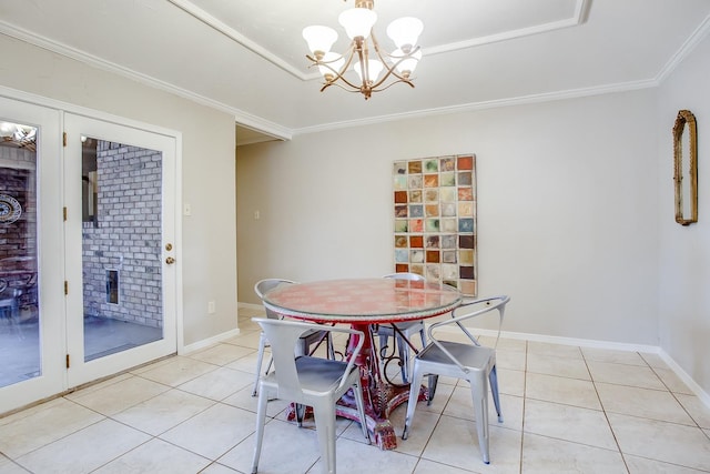 dining area featuring crown molding, light tile patterned flooring, and a chandelier