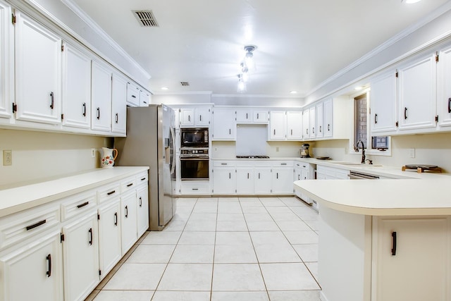 kitchen with crown molding, black appliances, and white cabinets