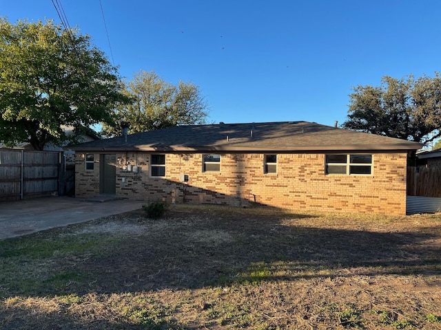 rear view of property featuring a patio area