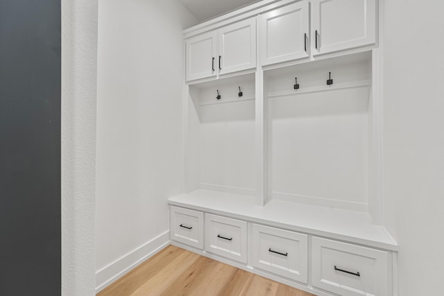 mudroom with light hardwood / wood-style floors